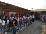 Michelle with students donating uniforms